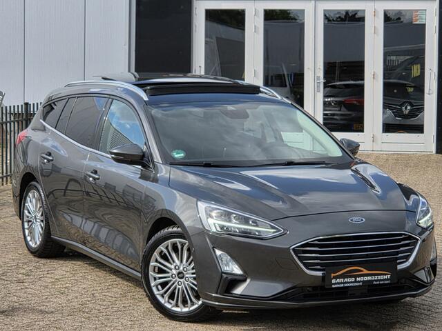 Ford FOCUS Wagon 1.0 EcoBoost Titanium Business PANORAMADAK|NAVIGATIE|CRUISE CONTROL|CAMERA|KEY LESSGO|BANG&OLUFSEN| MUZIEK|PDC VOOR+ACHTER|GETINT GLAS|ELEKTRISCHE KLEP|17 INCH Maandag tot Vrijdag geopend van 09.00 tot 20.00 uur geopend en Zaterdag van 09.00 tot 18.
