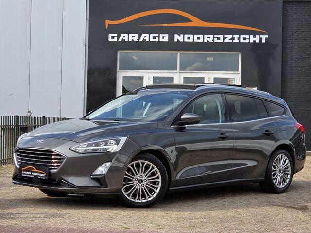 Ford FOCUS Wagon 1.0 EcoBoost Titanium Business PANORAMADAK|NAVIGATIE|CRUISE CONTROL|CAMERA|KEY LESSGO|BANG&OLUFSEN| MUZIEK|PDC VOOR+ACHTER|GETINT GLAS|ELEKTRISCHE KLEP|17 INCH Maandag tot Vrijdag geopend van 09.00 tot 20.00 uur geopend en Zaterdag van 09.00 tot 18.