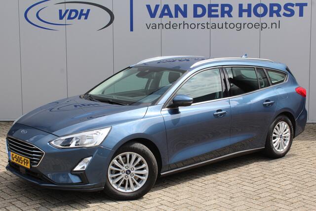 Ford FOCUS Wagon 1.0-125pk EcoBoost Titanium Business. Ruime, zeer geschikte gezinsauto ! Autm. airco dual, stoel-, stuur- en voorraamverw., LM wielen, trekhaak, metallic lak, navigatie, telefoonvoorb., cruise control etc