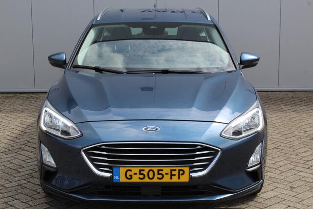 Ford FOCUS Wagon 1.0-125pk EcoBoost Titanium Business. Ruime, zeer geschikte gezinsauto ! Autm. airco dual, stoel-, stuur- en voorraamverw., LM wielen, trekhaak, metallic lak, navigatie, telefoonvoorb., cruise control etc