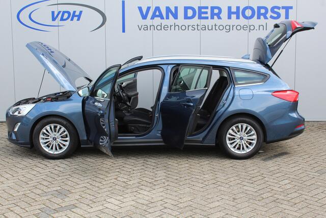 Ford FOCUS Wagon 1.0-125pk EcoBoost Titanium Business. Ruime, zeer geschikte gezinsauto ! Autm. airco dual, stoel-, stuur- en voorraamverw., LM wielen, trekhaak, metallic lak, navigatie, telefoonvoorb., cruise control etc