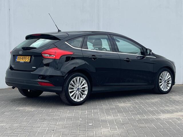 Ford FOCUS 1.0 Titanium / Navigatie full map / Cruise- en Climate Control / Parkeersensoren voor en achter / Keyless Start / Verwarmde Voorruit / Bluetooth / Radio / All Season Banden