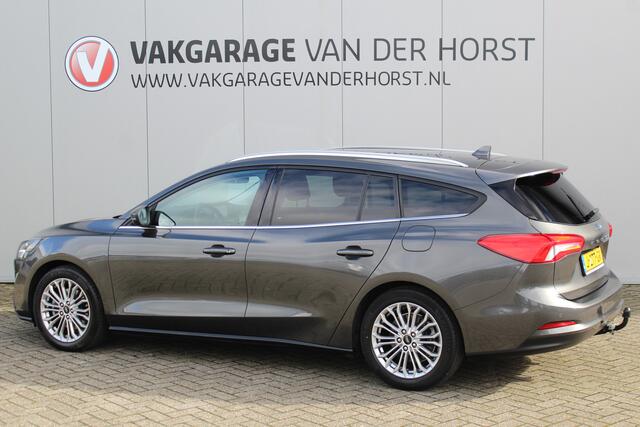 Ford FOCUS Wagon 1.0-125pk EcoBoost Titanium Business. Uiterst nette, comfortabele en ruime stationcar. Stoel-, stuur- en voorraamverw., Trekhaak, B&O soundsyst, lane assist, adaptieve cruise cntrl, camera a, LM wln, navigatie, telefoonvoorb. etc