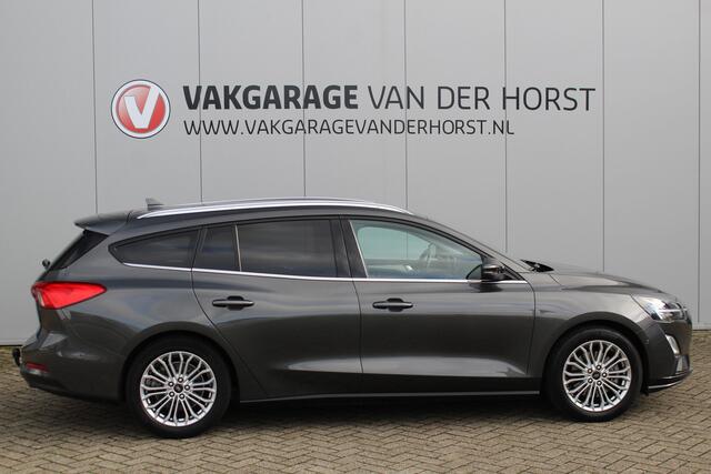 Ford FOCUS Wagon 1.0-125pk EcoBoost Titanium Business. Uiterst nette, comfortabele en ruime stationcar. Stoel-, stuur- en voorraamverw., Trekhaak, B&O soundsyst, lane assist, adaptieve cruise cntrl, camera a, LM wln, navigatie, telefoonvoorb. etc