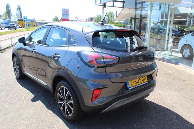 Ford PUMA 1.0-125pk EcoBoost Hybrid Titanium. Garantie t/m 21-05-2027 ! Slechts 14.750km ! Volautm. airco, metallic lak, stoel-, stuur- en voorraamverwarming, navigatie, telefoonvoorbereiding, elektrische achterklep, cruise cntrl, keyless entry / keyless go etc.