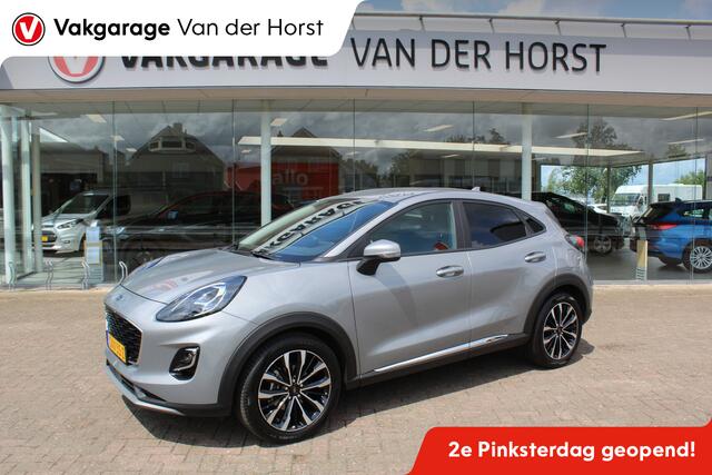 Ford PUMA 1.0-125pk EcoBoost Mild-Hybrid Titanium X. Garantie t/m 07-03-2028 ! Slechts 7.400km ! Cruise cntrl, climate cntrl, stoel-, stuur- en voorraamverw., draadloos opladen telefoon, trekhaak afneembaar, navigatie, telefoonvoorb., LM wielen, B&O soundsyst., dig