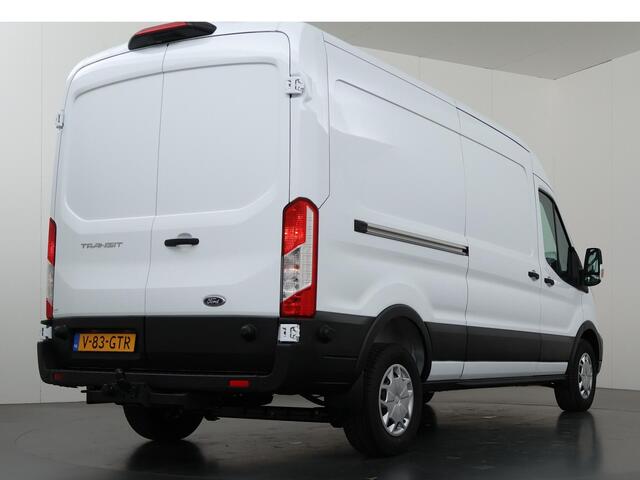 Ford TRANSIT 350 2.0 TDCI L3 H2 Trend | Navigatie | Stoelverwarming | Trekhaak 2500 KG AHW | Airco | 3-Zits | NIEUW | Carplay - Android Auto | Laadruimte Pakket | Cruise Control | Multifuntioneel Stuurwiel