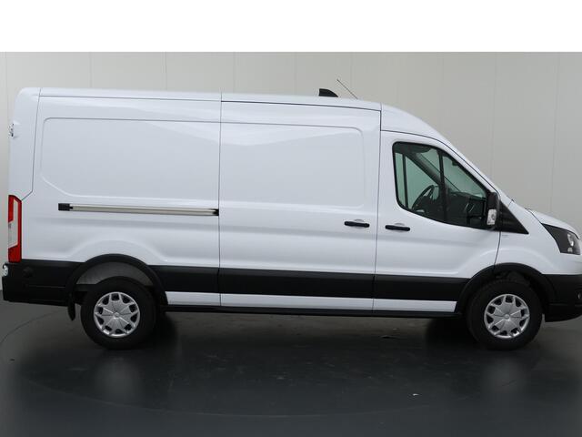 Ford TRANSIT 350 2.0 TDCI L3 H2 Trend | Navigatie | Stoelverwarming | Trekhaak 2500 KG AHW | Airco | 3-Zits | NIEUW | Carplay - Android Auto | Laadruimte Pakket | Cruise Control | Multifuntioneel Stuurwiel