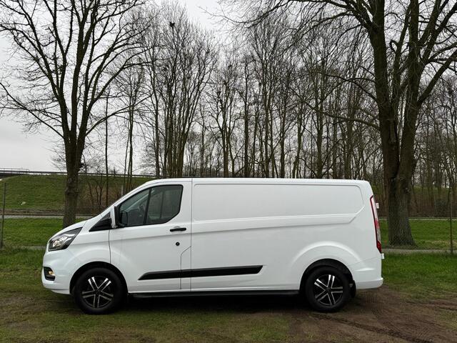 Ford TRANSIT CUSTOM 320 2.0 TDCI L2H1 Automaat | RAPTOR GRILL | SIDEBARS | CAMERA | CRUISE |