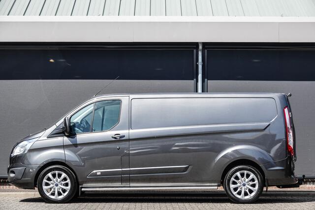 Ford TRANSIT CUSTOM L2H1 2.2Tdci 125Pk | Anniversary Edition | Stoel-Bank | Achteruitrijcamera | Trekhaak | Side Bars | 18'' | Magnetic Grey
