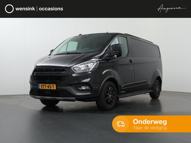 Ford TRANSIT CUSTOM 300 2.0 TDCI L2 H1 | TRAIL UITVOERING | LEDEREN BEKLEDING | NAVIGATIE | CAMERA | CRUISE CONTROL | TREKHAAK | LM VELGEN | TREEPLANKEN | NL AUTO