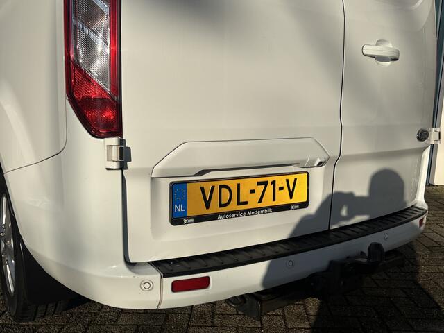 Ford TRANSIT CUSTOM 300 2.0 130Pk TDCI L2H1 Limited / Cruise / Airco / Navi / Trekhaak / Apk t/m 26-11-2025