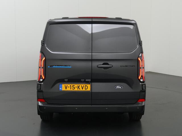 Ford TRANSIT CUSTOM E-Transit 340 | L2 H1 | LIMITED | 65 kWh | 218 PK | 328 KM WLTP | ADAPTIVE CRUISE | LED | STOELVERWARMING | PARKEERPAKKET | NAVIGATIE | 2-ZITS | ELEKTRISCHE TREKHAAK | LAADRUIMTE PAKKET | SNEL LADEN | CARPLAY / ANDROID AUTO | 2300 KG AHW