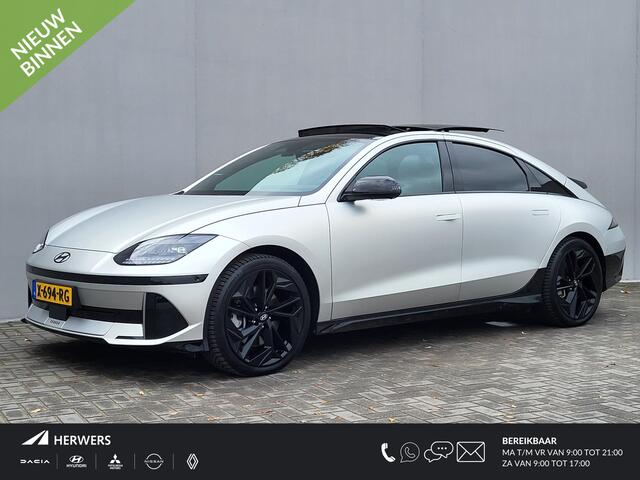 Hyundai IONIQ 6 First Edition AWD 77.4 kWh Automaat / 100% SOH / Origineel NL Auto / tot 04-2009 Fabrieksgarantie / Allseason banden / Schuifkanteldak / 360° camera / Navigatie / Headup Display / Android Auto / Apple Carplay / BOSE audio / Stuur-, voorstoel- en achterb