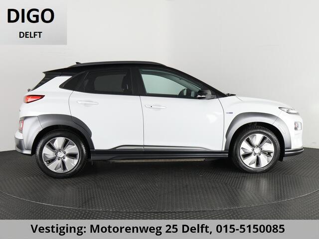 Hyundai Kona PRIMIUM EV 64 KWH 1e EIG ACCU 92% GARANTIE 10-2030 BEREIK 466 KM ! LEDER. STUUR/STOEL VERWARMING.DODE HOEK DETECTIE