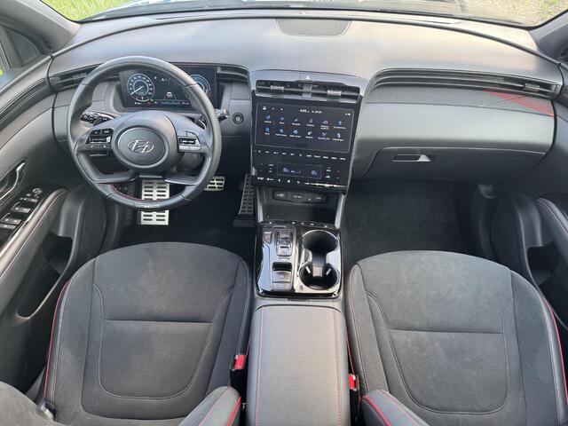 Hyundai TUCSON 1.6 T-GDI HEV N Line | Sidesteps | 1650 kg trekvermogen | Geïntegreerde navigatiesysteem | Stoelverwarming | Android Auto & Apple Carplay | 19'' Lichtmetalen velgen |