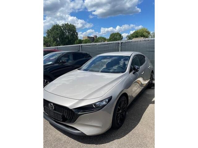 Mazda 3 2.0 e-SkyActiv-X M Hybrid 186 Nagisa Demovoordeel ¤ 5.000,-, Bruin Leder, Bose, Navi, Adap.Cruise, Clima, Apple Carplay, Camera, PDC, HUD, Stoelverwarming, 18" LMV