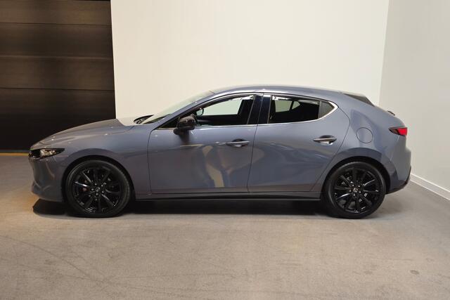 Mazda 3 2.0 e-SkyActiv-G M Hybrid 150 Homura - Stoelverwarming - Apple Carplay/ Android Auto - Adaptive Cruise - Bose audio - Headup display - Afneembare trekhaak