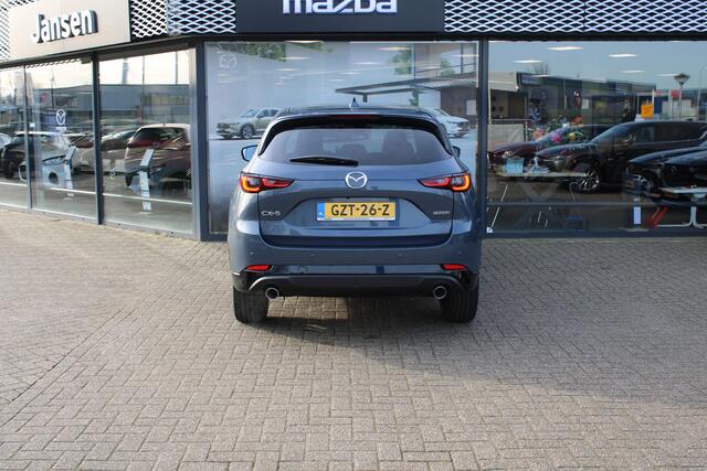 Mazda CX-5 2.0 e-SkyActiv-G M Hybrid 165 Homura , Demovoordeel ¤ 6.390-, Navi, Adap.Cruise, Clima, Leder, Apple Carplay, 360 Camera, PDC, HUD, Stoelverwarming/ventilatie, 19" LMV, Elek.Achterklep