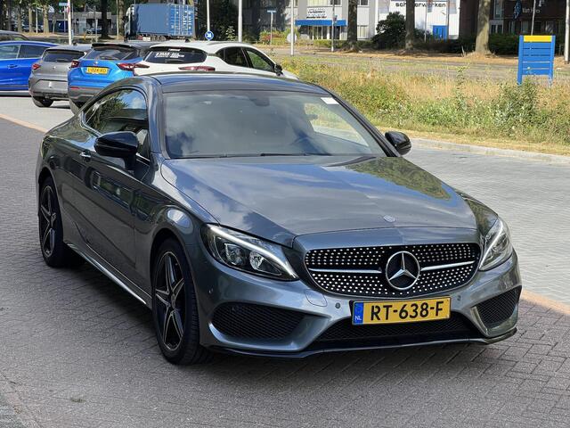 Mercedes-Benz C-KLASSE Coupé 180 Ambition | Schuifkanteldak | Stoelverwarming | Dodehoekdetectie | Navigatie