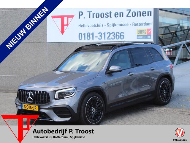 Mercedes-Benz GLB-Klasse AMG 35 4MATIC Premium Plus Panoramadak/Night pakket/Sfeerverlichting/Navigatie/Keyless/Cruise control/Climate control/Elektrisch verstelbare stoelen met memory/Stoelverwarming/Dodehoek detectie/Achteruitrijcamera/Parkeersensoren rondom/Elektrische achterk