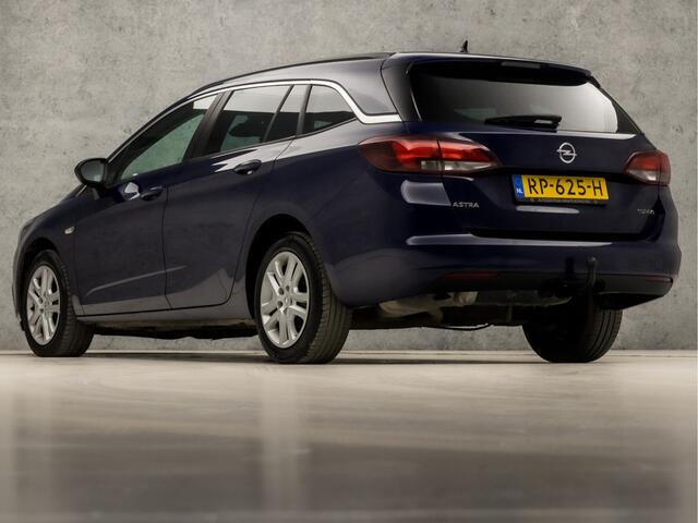Opel ASTRA Sports Tourer 1.4 Turbo Sport 150Pk (4 CILINDER, APPLE CARPLAY, GROOT NAVI, GETINT GLAS, CRUISE, SPORTSTOELEN, ARMSTEUN, TREKHAAK, NIEUWSTAAT)