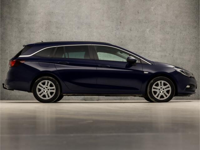 Opel ASTRA Sports Tourer 1.4 Turbo Sport 150Pk (4 CILINDER, APPLE CARPLAY, GROOT NAVI, GETINT GLAS, CRUISE, SPORTSTOELEN, ARMSTEUN, TREKHAAK, NIEUWSTAAT)