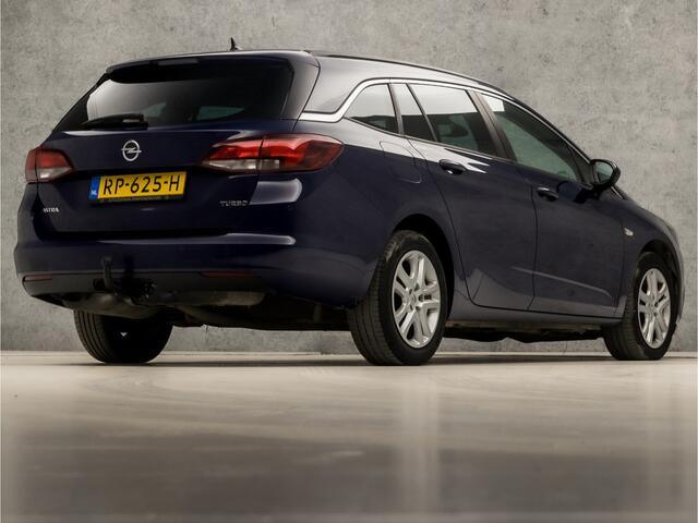 Opel ASTRA Sports Tourer 1.4 Turbo Sport 150Pk (4 CILINDER, APPLE CARPLAY, GROOT NAVI, GETINT GLAS, CRUISE, SPORTSTOELEN, ARMSTEUN, TREKHAAK, NIEUWSTAAT)