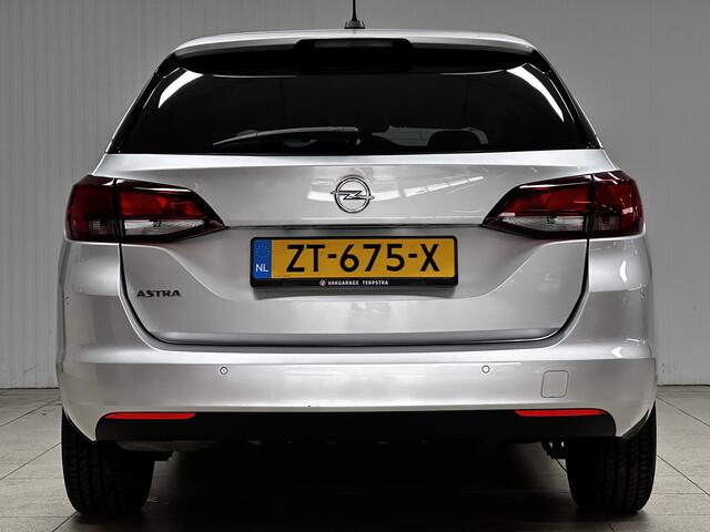 Opel ASTRA Sports Tourer 1.0 Turbo 120 Jaar Edition /Apple + Android /DAB+! /Navi /Climat /Cruise /Elek. pakket /Bluetooth /Regensensor /16"LMV /Extra getint glas /PDC V+A /LED Dagrijverl. /Dakrails.