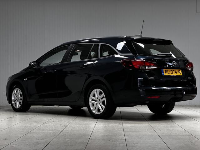 Opel ASTRA Sports Tourer 1.0 Online Edition/ Trekhaak/ Apple + Android/ DAB+/ Navi/ Airco/ Cruise/ Elek. pakket/ Isofix/ Bluetooth/ Armsteun/ Multi. LEDER. Stuur/ PDC V+a/ Dakrails/ LED Dagrijverl.