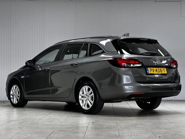 Opel ASTRA Sports Tourer 1.0 Online Edition/ PDC V+A/ Apple + Android/ DAB+/ Navi/ Airco/ Cruise/ Elek. pakket/ Isofix/ Bluetooth/ Armsteun/ Multi. LEDER. Stuur/ LED Dagrijverl.