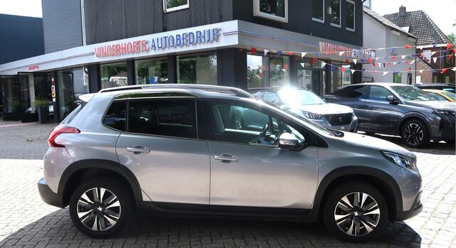 Peugeot 2008 1.2 Benzine * Hele Luxe Allure * Hoge Zit * Navigatie * Panoramadak * 1/2 Leder Interieur * Achteruitrij Camera * Climate & Cruise Control * Vingerhoets; Vierde Generatie Eersteklas Service !
