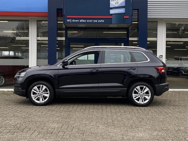 Skoda Karoq 1.0 TSI Business Edition / NL-Auto / 116 PK / 99.000 KM / 1e-Eigenaar / Vol-Leder / Trekhaak / LED-verlichting / Climate Control / Cruise Control / PDC V+A / Radio-Bluetooth-Navi / Carplay & Android auto / Draadloze telefoonlader /