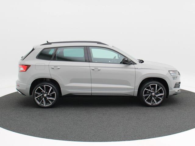 Skoda Karoq 1.5 TSi 150 Pk Sportline Business | LED | Camera | Canton Audio | Adaptive Cruise | Navigatiesysteem | Carplay | Keyless | 19 Inch