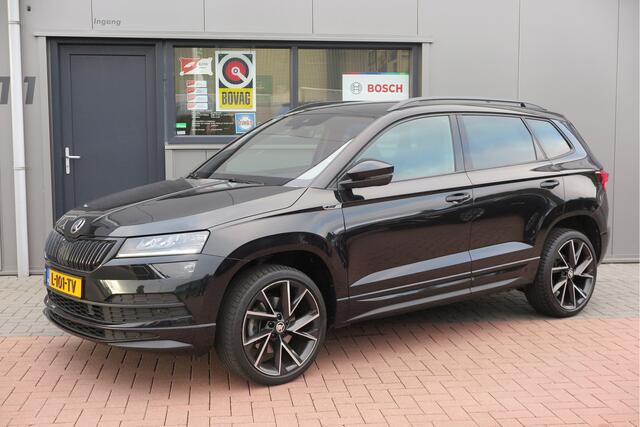 Skoda Karoq 1.5 TSI ACT 150pk Sportline Business Stoelverwarming , Led verlichting , DAB+ radio , Carplay ,Canton sound systeem, Achteruitrijcamera , Parkeersensoren ,Electr. achterklep ,etc.