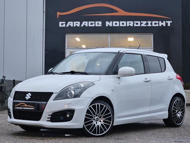 Suzuki SWIFT 1.6 Sport XENON|KEY LESSGO|CRUISE CONTROL|ECC/AIRCO|BLUE TOOTH TELEFONIE|USB|STOELVERWARMING|17 INCH Maandag tot Vrijdag geopend van 09.00 uur tot 20.00 uur en Zaterdag van 09.00 tot 18.00 uur