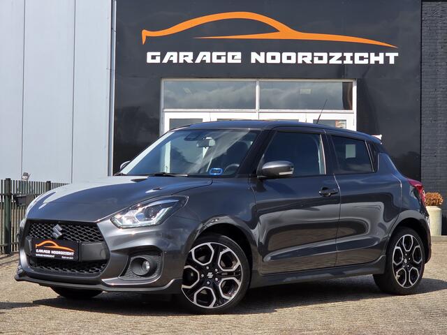 Suzuki SWIFT 1.4 Sport Smart Hybrid NAVIGATIE|CAMERA|CRUISE CONTROL|KEY LESSGO & ENTRY|GETINT GLAS|17 INCH|1E EIGENAAR|DEALER ONDERHOUDEN Maandag tot Vrijdag geopend van 09.00 tot 20.00 uur en Zaterdag van 09.00 tot 18.00 uur