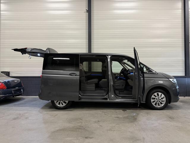 Volkswagen MULTIVAN 1.4 eHybrid Style 7p. LEER-ALCANTARA/TREKHAAK/IQ-LIGHT/EL.SCUIFDEUREN/SFEER/NAVI/CARPLAY/ADAPTIVE CRUISE/CHROOMSTRIP EXTERIEUR/PRIVACY/INDIUMGRAU-METALLIC/BOUWJAAR 04-2023/BTW-AUTO, PRIJS IS INCL. BTW