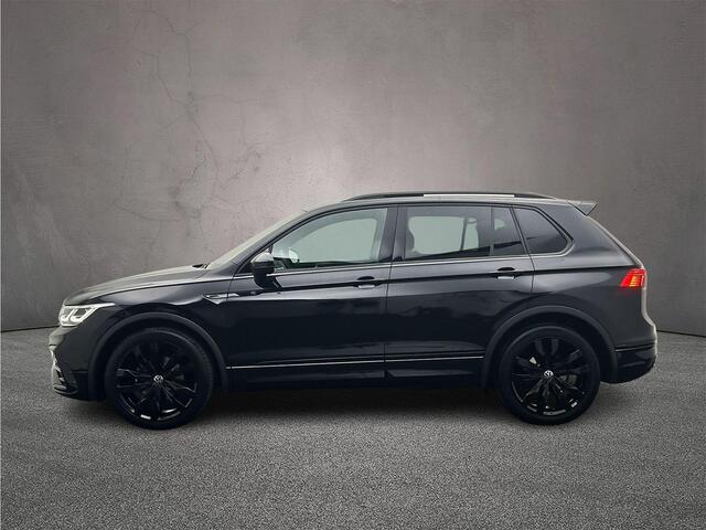 Volkswagen TIGUAN 1.5 TSI R-Line Business+ 150pk DSG, Lederen bekleding, Panoramadak, Black style, Trekhaak, Stoelverwarming, Stuurverwarming, Elektrische achterklep, Adaptieve cruise control, Dynamic chassis control, Navigatie, App connect