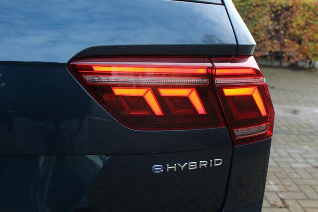 Volkswagen TIGUAN 1.4 TSI eHybrid R-Line Business+ | Incl. 12 maanden Garantie | Panorama dak | Memory stand stoelen | Stoel & Stuurverwarming | 360* Camera | Climate controle | Adaptive cruise | Elektrische kofferbakklep | Dodehoek detectie | IQ. Lights | Keyless entry/st