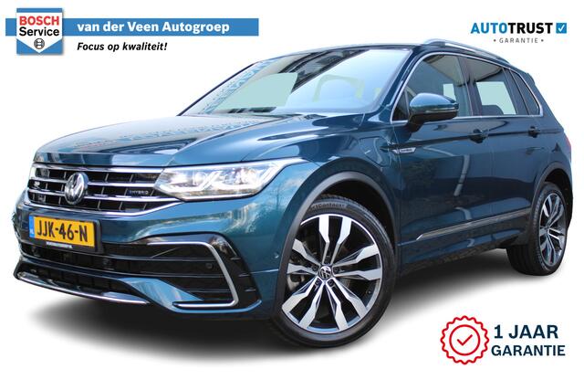 Volkswagen TIGUAN 1.4 TSI eHybrid R-Line Business+ | Incl. 12 maanden Garantie | Panorama dak | Memory stand stoelen | Trekhaak wegklapbaar | Stoel & Stuurverwarming | 360* Camera | Climate controle | Adaptive cruise | Elektrische kofferbakklep | Dodehoek detectie | IQ. Li