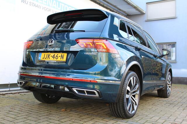 Volkswagen TIGUAN 1.4 TSI eHybrid R-Line Business+ | Incl. 12 maanden Garantie | Panorama dak | Memory stand stoelen | Trekhaak wegklapbaar | Stoel & Stuurverwarming | 360* Camera | Climate controle | Adaptive cruise | Elektrische kofferbakklep | Dodehoek detectie | IQ. Li