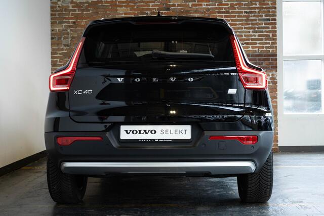 Volvo XC40 T4 Recharge Inscription | 360° Parkeercamera | Semi Electrische Wegklapbare trekhaak | 4-Seizoenenbanden | Draadloze telefoonlader | Panoramadak | Harman Kardon Premium Audio | Stoel en Stuurwielverwarming | Parkeersensoren voor + achter | Parkeerverwarmi