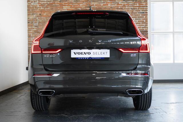 Volvo XC60 B5 Automaat Business Pro | Trekhaak | 360° parkeercamera | Adaptive cruise control | BLIS | Stoelverwarming | Stuurwielverwarming | Navigatie | Maroon lederen bekleding | Comfortstoelen |